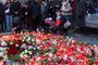 Well wishers light candles as people mourn at a makeshift memorial for the victims outside the Charles University in central Prague, on December 22, 2023, as police investigators kept working on the campus the day after a deadly mass shooting. The gunman who opened fire at Prague's Charles University killed 13 people and then himself, Czech authorities said, revising the toll from 14 victims. Czech authorities sought a motive in the a student's gun attack at the Charles University's Faculty of Arts. The gunman, a 24-year-old student, died during the attack on December 21, 2023. (Photo by Radek Mica / AFP)<!-- NICAID(15633171) -->