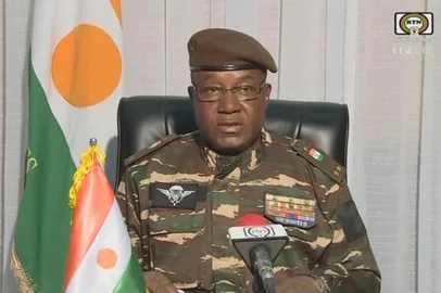 This video frame grab image obtained by AFP from ORTN - Télé Sahel on July 28, 2023 shows General Abdourahamane Tchiani, Nigers new strongman, speaking on national television and reads a statement as "President of the National Council for the Safeguarding of the Fatherland", after the ouster of President-elect Mohamed Bazoum. The chief of the Presidential Guard justifies the coup by evoking "the continued deterioration of the security situation" in the country, as well as "poor economic and social governance". (Photo by ORTN - Télé Sahel / AFP)<!-- NICAID(15494554) -->