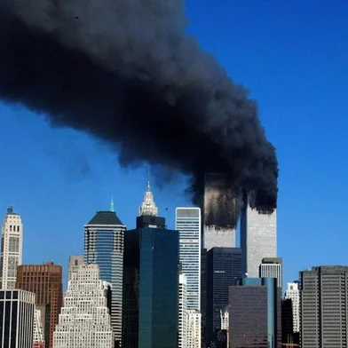 (FILES) In this file photo taken on September 10, 2001, the twin towers of the World Trade Center billow smoke after hijacked airliners crashed into them. - The remains of two more victims of 9/11 have been identified, thanks to advanced DNA technology, New York officials announced on September 8, 2021, just days before the 20th anniversary of the attacks. The office of the city's chief medical examiner said it had formally identified the 1,646th and 1,647th victim of the al-Qaeda attacks on New York's Twin Towers which killed 2,753 people. They are the first identifications of victims from the collapse of the World Trade Center since October 2019. (Photo by HENNY RAY ABRAMS / AFP)<!-- NICAID(14885125) -->