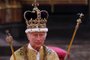 Britain's King Charles III walks wearing St Edward's Crown during the Coronation Ceremony inside Westminster Abbey in central London on May 6, 2023. - The set-piece coronation is the first in Britain in 70 years, and only the second in history to be televised. Charles will be the 40th reigning monarch to be crowned at the central London church since King William I in 1066. Outside the UK, he is also king of 14 other Commonwealth countries, including Australia, Canada and New Zealand. Camilla, his second wife, will be crowned queen alongside him and be known as Queen Camilla after the ceremony. (Photo by Richard POHLE / POOL / AFP)<!-- NICAID(15421583) -->