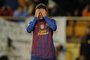 Barcelona's Argentinian forward Lionel Messi (R) reacts during the Spanish league football match Villareal CF vs Barcelona on January 28, 2012 at El Madrigal stadium in Villareal. The match ended in a 0-0 draw. AFP PHOTO/ JOSE JORDAN<!-- NICAID(7902517) -->