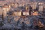An aerial photo shows collapsed buildings in Antakya on February 11, 2023, after a 7.8-magnitude earthquake struck the country's southeast earlier in the week. - The death toll from a massive earthquake that hit Turkey and Syria climbed to more than 20,000 on February 9, 2023, as hopes faded of finding survivors stuck under rubble in freezing weather. (Photo by Hassan AYADI / AFP)<!-- NICAID(15347676) -->
