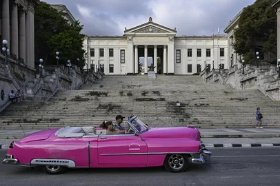 YAMIL LAGE / AFP An old car drives past the University of Havana on May 13, 2026. Since February 2026, the fuel crisis in Cubamarked by the oil blockade imposed by the United Stateshas left universities without in-person classes. Today, practical degrees such as architecture and design are surviving amid blackouts, shortages and slashed programmes. Training has become so fragmented that an entire generation fears they are being left professionally half-formed. (Photo by YAMIL LAGE / AFP)<!-- NICAID(16287712) -->