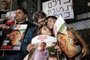 Israeli freed hostage Yocheved Lifshitz (C), 85, takes part in a protest with her family members outside the Ministry of Defence in Tel Aviv on November 28, 2023. Her husband Oded is reportedly still held hostage in Gaza by Hamas. (Photo by Oren ZIV / AFP)<!-- NICAID(15611417) -->