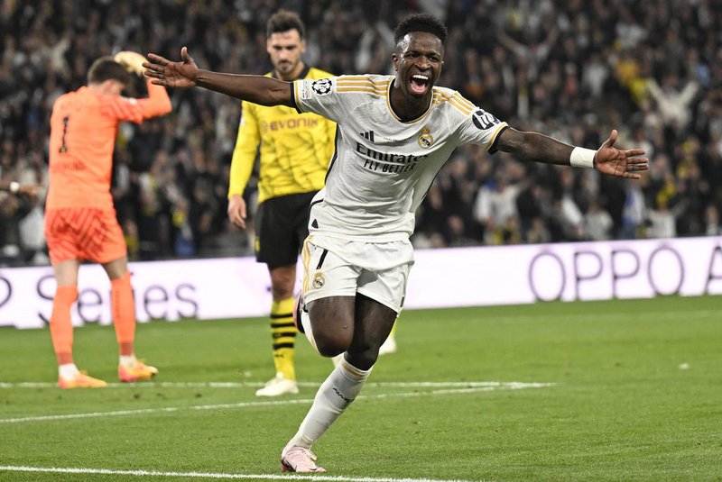 Real Madrid's Brazilian forward #07 Vinicius Junior celebrates scoring his team's second goal during the UEFA Champions League final football match between Borussia Dortmund and Real Madrid, at Wembley stadium, in London, on June 1, 2024. (Photo by INA FASSBENDER / AFP)<!-- NICAID(15778618) -->