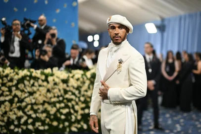British car driver Lewis Hamilton arrives for the 2025 Met Gala at the Metropolitan Museum of Art on May 5, 2025, in New York. The Gala raises money for the Metropolitan Museum of Art's Costume Institute. The 2025 Met Gala is themed "Tailored for You," aligning with the Costume Institutes exhibition, "Superfine: Tailoring Black Style," set to open to the public on May 10. (Photo by Angela WEISS / AFP)<!-- NICAID(16030885) -->