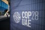 A man walks past a COP28 sign at the venue of the United Nations climate summit in Dubai on November 30, 2023. The UN climate conference opens in Dubai on November 30 with nations under pressure to increase the urgency of action on global warming and wean off fossil fuels, amid intense scrutiny of oil-rich hosts UAE. (Photo by Jewel SAMAD / AFP)Editoria: WEALocal: DubaiIndexador: JEWEL SAMADSecao: diplomacyFonte: AFPFotógrafo: STF<!-- NICAID(15612680) -->