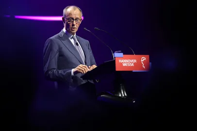 German Chancellor Friedrich Merz delivers a speech during the opening gala of the Hanover industrial trade fair for mechanical and electrical engineering and digital industries, in Hanover, northern Germany on April 19, 2026. The fair opens its doors to the public on April 20 and will be running until April 24, 2026. (Photo by Ronny HARTMANN / AFP)<!-- NICAID(16268937) -->