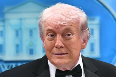 US President Donald Trump speaks during a press briefing in the Brady Briefing Room at the White House in Washington, DC, shortly after a shooting incident at the White House Correspondents Dinner on April 25, 2026. US President Donald Trump said April 25 he would give a press conference from the White House press briefing room, shortly after a shooting incident at a gala dinner in Washington. The press conference is set to take place shortly after 10 p.m. (0200 GMT), Trump wrote on his Truth Social platform, adding: "The First Lady, plus the Vice President, and all Cabinet members, are in perfect condition." (Photo by Mandel NGAN / AFP)<!-- NICAID(16272970) -->