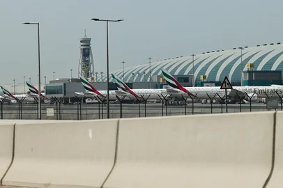 Emirates airline planes are parked on the tarmac at Dubai International Airport in Dubai on March 2, 2026. Israel bombarded Lebanon on March 2 following rocket fire from Hezbollah, several American warplanes crashed in Kuwait and Iran lashed out against the region with missiles, as the war with Israel and the United States expanded. (Photo by Fadel SENNA / AFP)<!-- NICAID(16236527) -->
