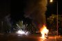Fireworks explode during protests in Nanterre, west of Paris, on June 28, 2023, a day after a 17-year-old boy was shot in the chest by police at point-blank range in this western suburb of Paris. Violent protests broke out in France in the early hours of June 29, 2023, as anger grows over the police killing of a teenager, with security forces arresting 150 people in the chaos that saw balaclava-clad protesters burning cars and setting off fireworks. Nahel M., 17, was shot in the chest at point-blank range on June 27, 2023, morning in an incident that has reignited debate in France about police tactics long criticised by rights groups over the treatment of people in low-income suburbs, particularly ethnic minorities. (Photo by Zakaria ABDELKAFI / AFP)<!-- NICAID(15469126) -->