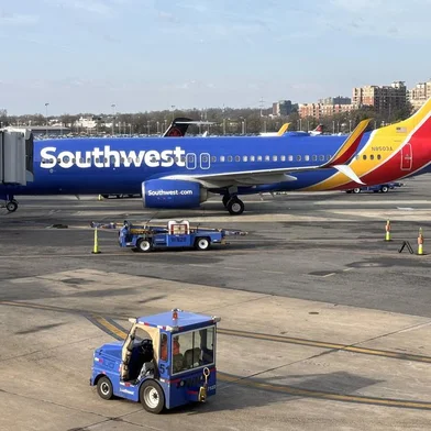 A Southwest Airlines Boeing 737 sits at a gate at Washington's Reagan National Airport (DCA) in Arlington, Virginia, on March 31, 2024. (Photo by Daniel SLIM / AFP)<!-- NICAID(15728304) -->