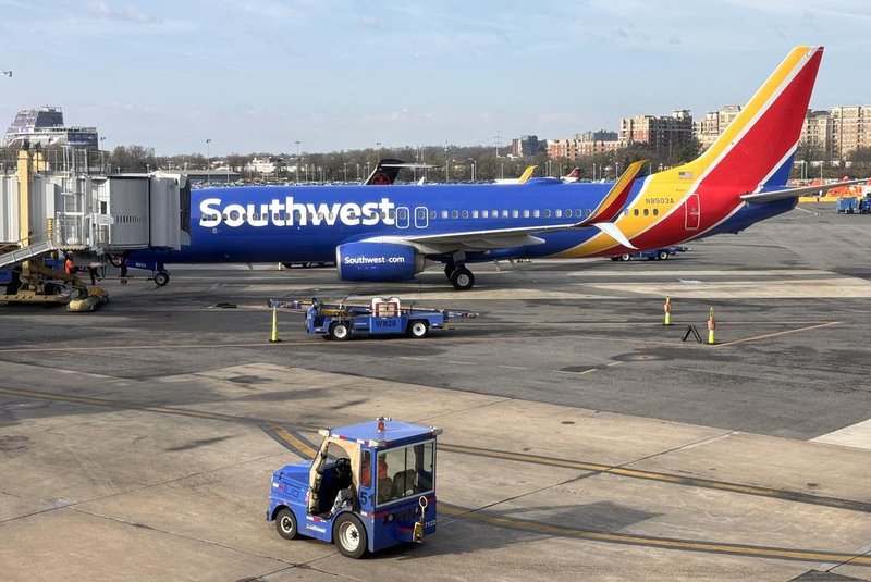 A Southwest Airlines Boeing 737 sits at a gate at Washington's Reagan National Airport (DCA) in Arlington, Virginia, on March 31, 2024. (Photo by Daniel SLIM / AFP)<!-- NICAID(15728304) -->
