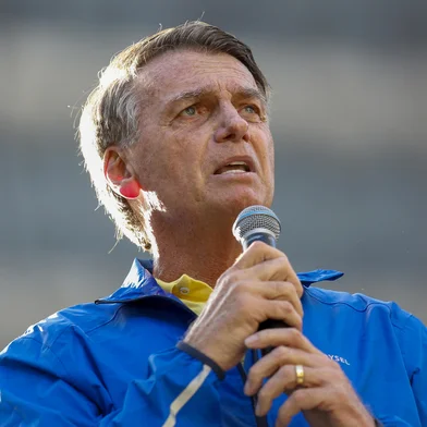 Brazil's former President Jair Bolsonaro speaks during a rally on Paulista Avenue in Sao Paulo, Brazil, on June 29, 2025. Former Brazilian President Jair Bolsonaro called on his supporters on Sunday to demonstrate in Sao Paulo in the name of "justice," as he faces the threat of spending several decades in prison for an alleged coup attempt. (Photo by Miguel SCHINCARIOL / AFP)<!-- NICAID(16069854) -->