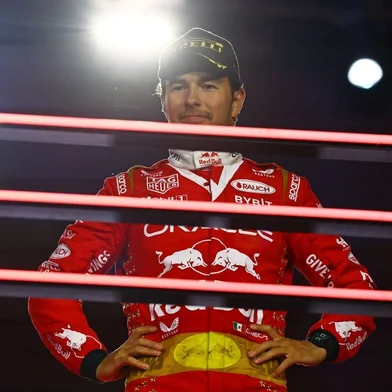 LAS VEGAS, NEVADA - NOVEMBER 18: Third placed Sergio Perez of Mexico and Oracle Red Bull Racing looks on from the podium during the F1 Grand Prix of Las Vegas at Las Vegas Strip Circuit on November 18, 2023 in Las Vegas, Nevada. Mark Thompson/Getty Images/AFP