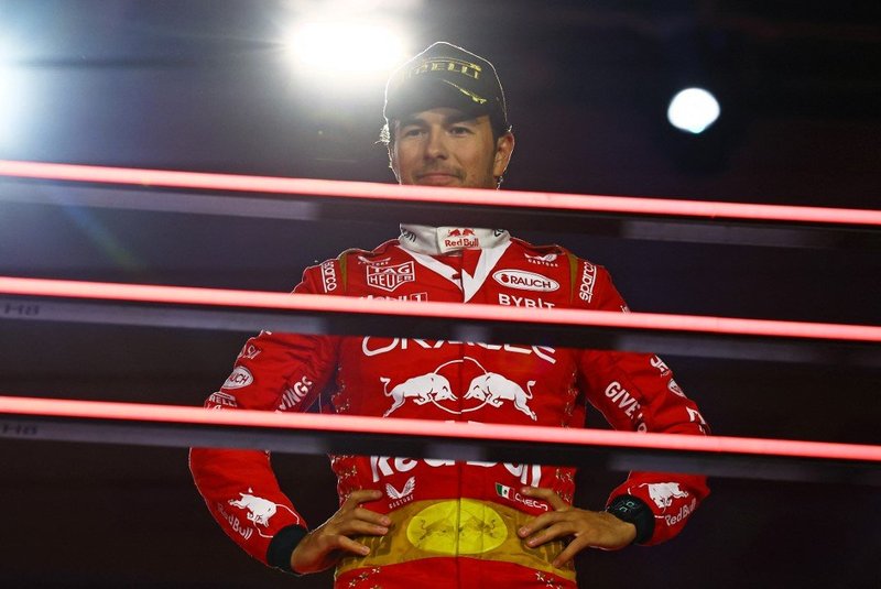 LAS VEGAS, NEVADA - NOVEMBER 18: Third placed Sergio Perez of Mexico and Oracle Red Bull Racing looks on from the podium during the F1 Grand Prix of Las Vegas at Las Vegas Strip Circuit on November 18, 2023 in Las Vegas, Nevada. Mark Thompson/Getty Images/AFP