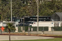 Police vehicles are seen following an explosion at the Los Angeles County Sheriff Department's Biscailuz Training Center in East Los Angeles, California, on July 18, 2025. Three people died Friday in an "incident" at a police training facility in Los Angeles, the US government said, with media reports saying there had been an accidental explosion. California Governor Gavin Newsom's office said he had been briefed on "the reported explosion" and was "closely monitoring the situation." (Photo by Patrick T. Fallon / AFP)<!-- NICAID(16083673) -->