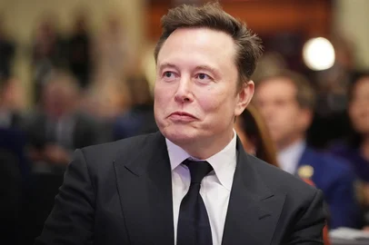 WASHINGTON, DC - NOVEMBER 13: Elon Musk listens as U.S. President-elect Donald Trump addresses a House Republicans Conference meeting at the Hyatt Regency on Capitol Hill on November 13, 2024 in Washington, DC. As is tradition with incoming presidents, Trump is traveling to Washington, DC to meet with U.S. President Joe Biden at the White House as well as meet with Republican congressmen on Capitol Hill.   Andrew Harnik/Getty Images/AFP (Photo by Andrew Harnik / GETTY IMAGES NORTH AMERICA / Getty Images via AFP)<!-- NICAID(15915277) -->