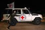 An International Red Cross vehicle reportedly carrying hostages released by Hamas drives towards the Rafah border point with Egypt ahead of their transfer to Israel on November 25, 2023. A group of 13 Israeli and four Thai hostages released by Hamas crossed into Egypt late Saturday, Egyptian state-linked television reported. (Photo by SAID KHATIB / AFP)<!-- NICAID(15608784) -->