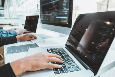 Developing programmer Team Development Website design and coding technologies working in software company officeFonte: 330431540<!-- NICAID(14716570) -->
