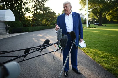 US President Donald Trump speaks to the press before boarding Marine One from the South Lawn of the White House in Washington, DC on June 24, 2025, to attend the NATO's Heads of State and Government summit in The Hague. (Photo by Mandel NGAN / AFP)<!-- NICAID(16065975) -->