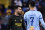 Paris Saint-Germain's Argentine forward Lionel Messi (L) walks past Riyadh All-Star's Portuguese forward Cristiano Ronaldo (R) during the Riyadh Season Cup football match between the Riyadh All-Stars and Paris Saint-Germain at the King Fahd Stadium in Riyadh on January 19, 2023. (Photo by FRANCK FIFE / AFP)<!-- NICAID(15326785) -->