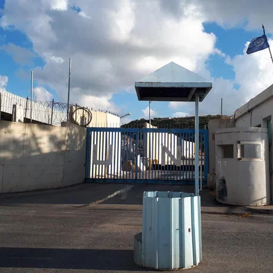 A picture shows an entrance gate of the United Nations peacekeeping force in Lebanon (UNIFIL) base in the southern town of Naqoura bordering Israel, on October 15, 2023. The UNIFIL said in a statement that its headquarters was struck by a rocket in the southern town of Naqoura, adding that no one was hurt and that the force was "working to verify from where". (Photo by AFP)<!-- NICAID(15569381) -->