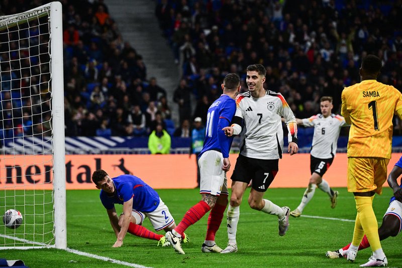 Germany's midfielder #07 Kai Havertz (C) celebrates after scoring Germany's second goal during the friendly football match between France and Germany, at the Groupama Stadium in Decines-Charpieu, near Lyon, on March 23, 2024. (Photo by Olivier CHASSIGNOLE / AFP)<!-- NICAID(15718701) -->