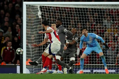 Arsenal's Spanish midfielder #23 Mikel Merino scores the team's third goal during the UEFA Champions League Quarter final first leg football match between Arsenal and Real Madrid, at the Emirates Stadium, in London, on April 8, 2025. (Photo by Adrian Dennis / AFP)<!-- NICAID(16016478) -->