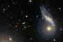 This NASA/ESA Hubble Space Telescope image features Arp 122, a peculiar galaxy that in fact comprises two galaxies – NGC 6040, the tilted, warped spiral galaxy and LEDA 59642, the round, face-on spiral – that are in the midst of a collision.<!-- NICAID(15691633) -->
