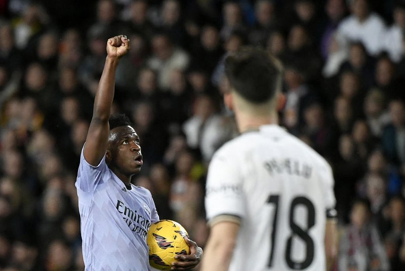 Real Madrid's Brazilian forward #07 Vinicius Junior celebrates scoring his team's first goal during the Spanish league football match between Valencia CF and Real Madrid at the Mestalla stadium in Valencia on March 2, 2024 (Photo by Jose Jordan / AFP) Real Madrid's Brazilian forward #07 Vinicius Junior celebrates scoring his team's first goal during the Spanish league football match between Valencia CF and Real Madrid at the Mestalla stadium in Valencia on March 2, 2024 (Photo by Jose Jordan / AFP)<!-- NICAID(15695167) -->