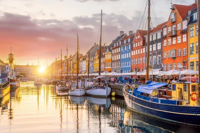 f11photo / Adobe Stock Cityscape of downtown Copenhagen city skyline in Denmark at famous old Nyhavn port at sunset<!-- NICAID(16324895) -->