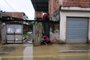 People try to remove water from their flooded house after a rainstorm in the Uruai neighborhood of Duque de Caxias city, on the outskirts of Rio de Janeiro, Brazil, on March 24, 2024. Rescuers in boats and aircraft raced against the clock Sunday to help isolated people in Brazil's mountainous southeast after storms and heavy rains killed at least 20 people. With more rain predicted Sunday, the deluge pounded the states of Rio de Janeiro and Espirito Santo, where authorities described a chaotic situation due to flooding. (Photo by Pablo PORCIUNCULA / AFP)<!-- NICAID(15714950) -->