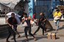 Palestinians storm a UN-run aid supply center, that distributes food to displaced families following Israel's call for more than one million residents in northern Gaza to move south for their safety, in Deir al-Balah on October 28, 2023, amid the ongoing battles between Israel and the Palestinian group Hamas. Thousands of civilians, both Palestinians and Israelis, have died since October 7, 2023, after Palestinian Hamas militants based in the Gaza Strip entered southern Israel in an unprecedented attack triggering a war declared by Israel on Hamas with retaliatory bombings on Gaza. (Photo by MOHAMMED ABED / AFP) / The erroneous mention[s] appearing in the metadata of this photo by MOHAMMED ABED has been modified in AFP systems in the following manner: [Storm] instead of [Collect boxes and and bags from]. Please immediately remove the erroneous mention[s] from all your online services and delete it (them) from your servers. If you have been authorized by AFP to distribute it (them) to third parties, please ensure that the same actions are carried out by them. Failure to promptly comply with these instructions will entail liability on your part for any continued or post notification usage. Therefore we thank you very much for all your attention and prompt action. We are sorry for the inconvenience this notification may cause and remain at your disposal for any further information you may require.<!-- NICAID(15582451) -->