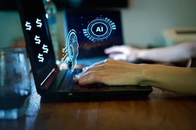 Creator Surrounded by Dollar Icons on Glowing Laptop, Passive Income Concept with Copy space, AI make money online concept.AI invesment trendsFonte: 1722276973<!-- NICAID(16147823) -->