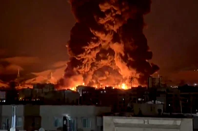- / UGC This video grab taken from UGC images posted on social media on March 7 and 8, 2026 shows fire erupting at an oil depot in Iran's capital Tehran. The United States and Israel launched strikes against Iran on February 28, sparking swift retaliation by the Islamic republic which responded with missile attacks across the region. The war has dragged in global powers, upended the world's energy and transport sectors, and brought chaos to even usually peaceful areas of the volatile region. (Photo by UGC / AFP) / NO USE AFTER MARCH 18, 2026 14:07:08 GMT - RESTRICTED TO EDITORIAL USE - MANDATORY CREDIT AFP - SOURCE: UGC / UNKNOWN - DISTRIBUTED AS A SERVICE TO CLIENTS - NO RESALE -<!-- NICAID(16241075) -->