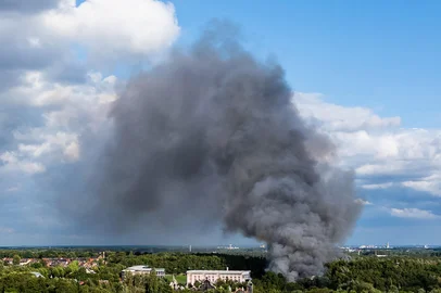 Smoke caused by a fire billows above the site of the Tomorrowland electronic music festival in Boom, northern Belgium on July 16, 2025. (Photo by Tom Goyvaerts / Belga / AFP) / Belgium OUT<!-- NICAID(16082198) -->