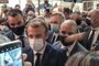 This video grab made from a footage by LyonMag.com shows an egg bouncing on French President Emmanuel Macron's shoulder while he was visiting the International Catering, Hotel and Food Trade Fair (SIRHA) in the French southeastern city of Lyon on September 27, 2021. - The assailant was quickly subdued and removed from the room, with Macron saying he would try to speak with him later. (Photo by Stefano RELLANDINI / LyonMag.com / AFP) / RESTRICTED TO EDITORIAL USE - MANDATORY CREDIT AFP PHOTO / LyonMag.com<!-- NICAID(14900218) -->