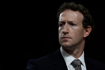 (FILES) Mark Zuckerberg, CEO of Meta, looks on during the US Senate Judiciary Committee hearing "Big Tech and the Online Child Sexual Exploitation Crisis" in Washington, DC, on January 31, 2024. Social media juggernaut Meta stands trial on April 14, 2025, facing serious US government allegations that it abused its market power to acquire Instagram and WhatsApp before they could become competitors. By moving forward, the trial in a Washington federal court dashes the hopes of Meta boss Mark Zuckerberg that the return of Donald Trump to the White House would see the government let up on the enforcement of antitrust law against Big Tech. (Photo by ANDREW CABALLERO-REYNOLDS / AFP)<!-- NICAID(16018768) -->