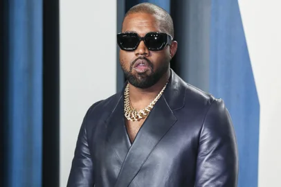 (FILES) In this file photo Kanye West attends the 2020 Vanity Fair Oscar Party following the 92nd annual Oscars at The Wallis Annenberg Center for the Performing Arts in Beverly Hills on February 9, 2020. - Entertainment mogul Kanye West on June 30, 2020 released a new song, "Wash Us In the Blood," along with an accompanying video including imagery from recent anti-racism protests. The new track, the first released from the born-again rapper's planned 10th album "God's Country," features lyrics with heavily biblical overtones, in line with his musical turn to Christianity in recent years. (Photo by Jean-Baptiste Lacroix / AFP)<!-- NICAID(14538337) -->