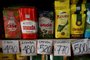 Different brands of yerba mate are seen with signs indicating their prices in Argentine pesos at the Central Market in Buenos Aires on May 12, 2023. Argentina's National Institute of Statistics and Census announced that April's Consumer Price Index rate increased 8.4% compared to March. (Photo by Luis ROBAYO / AFP)<!-- NICAID(15428430) -->