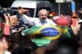 Brazilian former President (2003-2010) and candidate for the leftist Workers Party (PT) Luiz Inacio Lula da Silva waves at supporters while leaving the polling station, during the presidential run-off election, in Sao Paulo, Brazil, on October 30, 2022. - After a bitterly divisive campaign and inconclusive first-round vote, Brazil elects its next president in a cliffhanger runoff between far-right incumbent Jair Bolsonaro and veteran leftist Luiz Inacio Lula da Silva. (Photo by CARL DE SOUZA / AFP)<!-- NICAID(15250259) -->