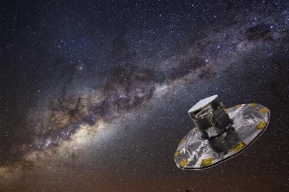 The Milky Way blazes above the European Southern Observatory (ESO) facilities at Mount Paranal in northern Chileâs Atacama Desert. Paranal hosts the worldâs most advanced ground-based astronomical observatory, the Very Large Telescope (VLT), and is home to two new telescopes for large imaging surveys currently under construction, the VLT Survey Telescope (VST) and the Visible and Infrared Survey Telescope for Astronomy (VISTA). Both are expected to âtake up dutyâ in the 2009-2010 timeframe.  This photograph shows an edge-on view of the Milky Wayâs glowing plane slicing across the night sky, laced by bands of dust and dark gas. Taken with a digital camera using a three-minute exposure, the photograph also reveals a bit of action on the ground. To the left, a vehicle with its parking lights on stops lets out a passenger. Though bathed by the light of the Milky Way, the high-altitude desert remains quite dark. To illuminate the rightward path to the underground entrance ramp of the âResidenciaâ, where staff and visitors stay, the passenger takes along a small flashlight, seen as a squiggly bright line. In the lower right, the glass dome on the Residenciaâs roof reflects the starry sky overhead. One of our Milky Wayâs galactic satellites, the Large Magellanic Cloud, is seen hanging above the Residencia in the lower right corner of the image.<!-- NICAID(15121785) -->