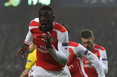 511785707Arsenal's French striker Yaya Sanogo celebrates scoring the opening goal during the UEFA Champions League Group D football match between Arsenal and Borussia Dortmund at the Emirates Stadium in north London on November 26, 2014. AFP PHOTO / BEN STANSALLEditoria: SPOLocal: LondonIndexador: BEN STANSALLSecao: SoccerFonte: AFPFotógrafo: STF<!-- NICAID(11013663) -->