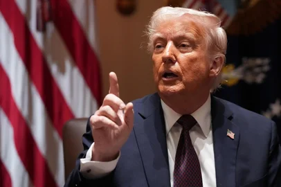 WASHINGTON, DC - MARCH 24: U.S. President Donald Trump calls on a reporter to ask a question during a cabinet meeting at the White House on March 24, 2025 in Washington, DC. This is Trump's third cabinet meeting of his second term, and it focused on spending cuts proposed by the Department of Government Efficiency (DOGE)   Win McNamee/Getty Images/AFP (Photo by WIN MCNAMEE / GETTY IMAGES NORTH AMERICA / Getty Images via AFP)<!-- NICAID(16002640) -->