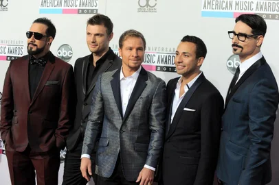 The  Backstreet Boys, from left, A. J. McLean, Nick Carter, Brian Littrell, Howie Dorough and Kevin Richardson, arrive at the 40th Anniversary American Music Awards on Sunday, Nov. 18, 2012, in Los Angeles.