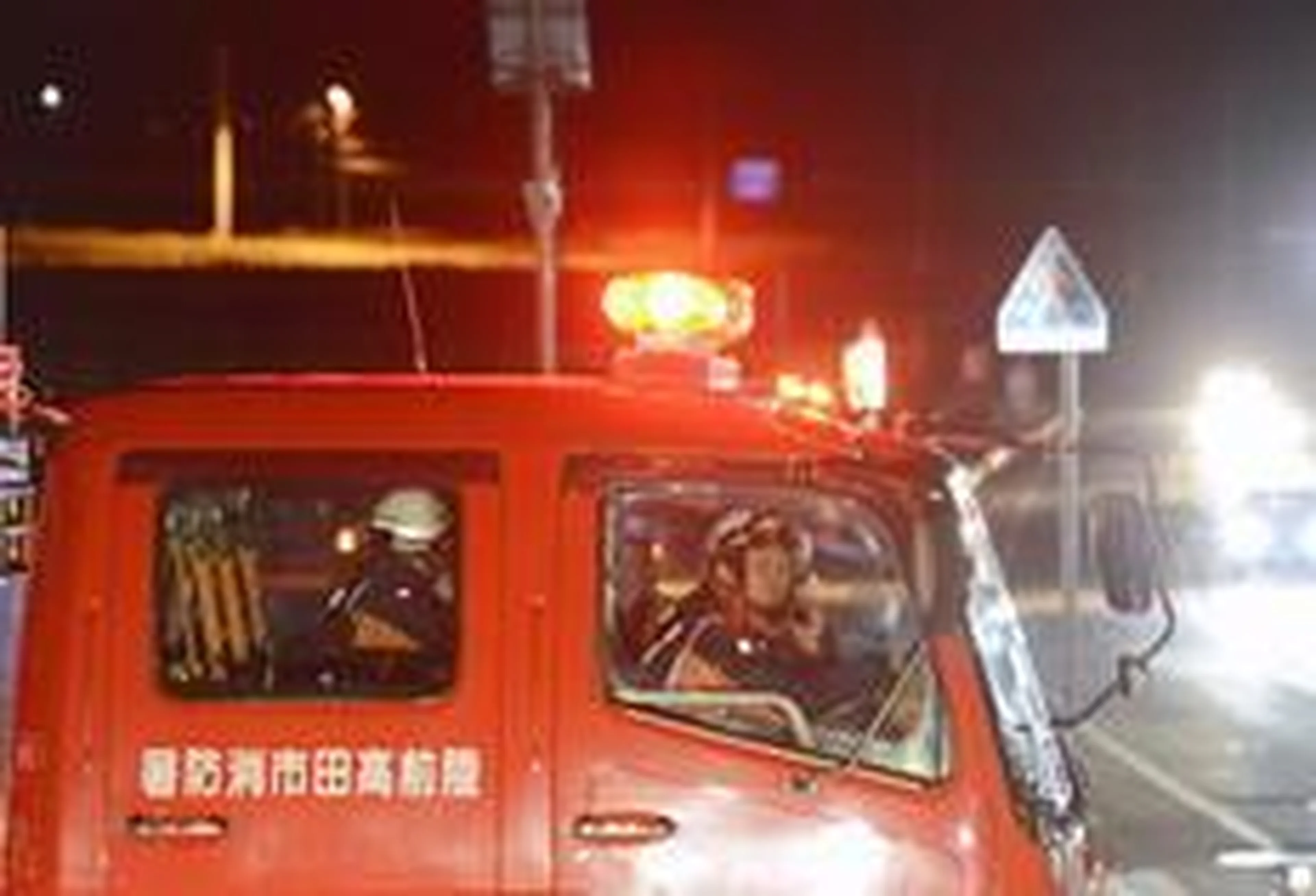 Kyodo News/AP