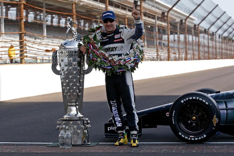 INDIANAPOLIS, IN - MAY 27: 2013 Indianapolis 500 Champion Tony Kanaan of Brazil, driver of the Hydroxycut KV Racing Technology-SH Racing Chevrolet, poses with the Borg Warner Trophy on the yard of bricks during the Indianapolis 500 Mile Race Trophy Presentation and Champions Portrait Session at Indianapolis Motor Speedway on May 27, 2013 in Indianapolis, Indiana. Kanaan earned his first Indy 500 victory by winning the 97th running of the race.   Chris Graythen/Getty Images/AFP