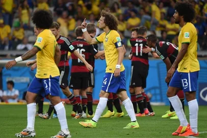 Brazil's defender David Luiz (C) gestures during the semi-final football match between Brazil and Germany at The Mineirao Stadium in Belo Horizonte on July 8, 2014, during the 2014 FIFA World Cup . AFP PHOTO / PEDRO UGARTE