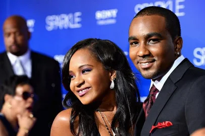 (FILES) Bobbi Kristina Brown (R) and Nick Gordon arrive at Tri-Star Pictures' "Sparkle" premiere at Grauman's Chinese Theatre in this August 16, 2012, file photo in Hollywood, California. Brown, the daughter of late singer Whitney Houston, was pulled unconscious from her bathtub at her home in Georgia in an eerie echo of her mother's tragic death three years ago, several US media reports said on January 31, 2015. The Atlanta Journal Constitution quoted local police as saying that Bobbi Kristina Brown, 21, was found by her husband and a friend at her home in Roswell, roughly 22 miles (35 kilometers) north of Atlanta. Emergency services were called to the scene before Brown was whisked to North Fulton Hospital for treatment, the report said. A spokeswoman for Roswell Police Department was not immediately available for comment.  Frazer Harrison/Getty Images/AFP/FILES